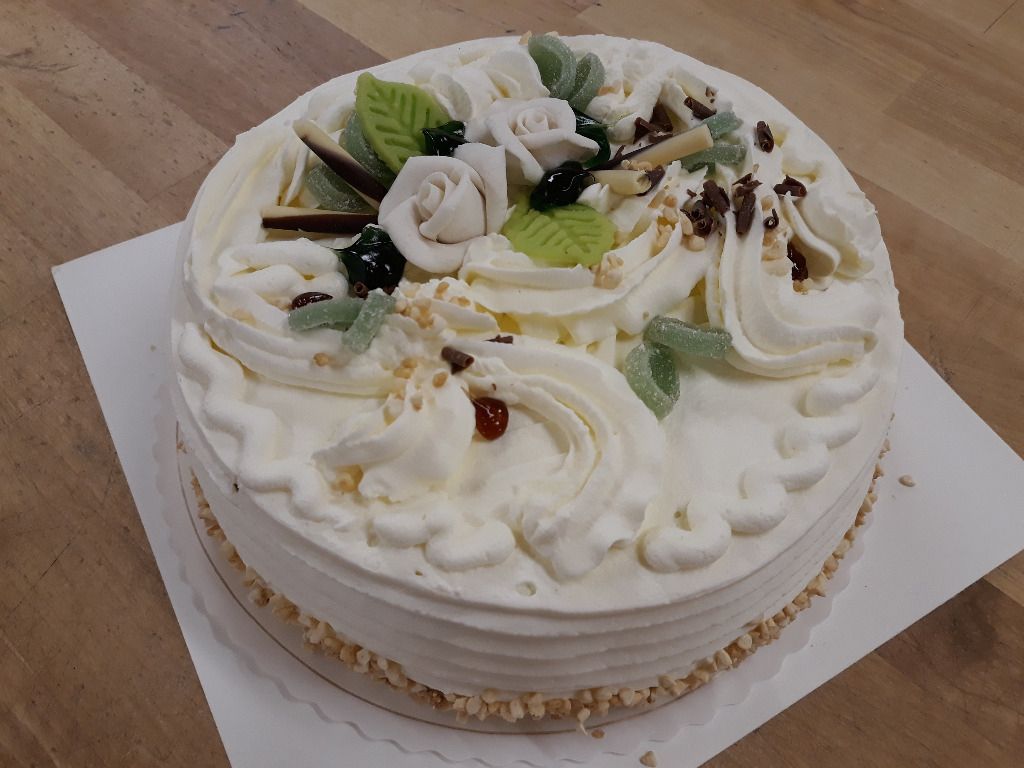 Large white layer cake with decorations